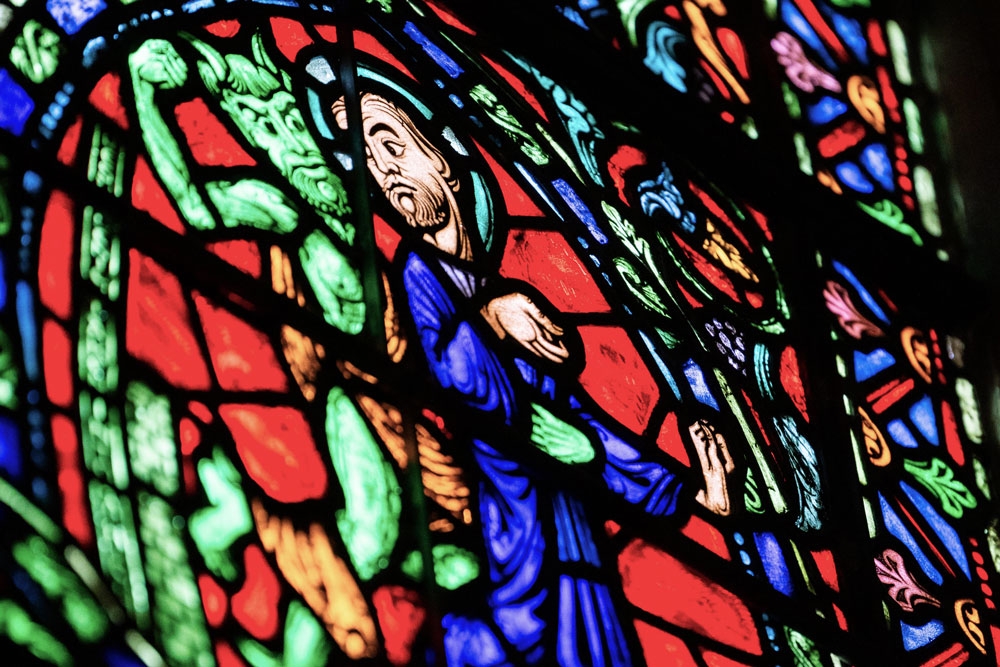Duke Chapel's stained-glass window's depict the biblical scene in which Jesus is tempted by the Devil in the desert.