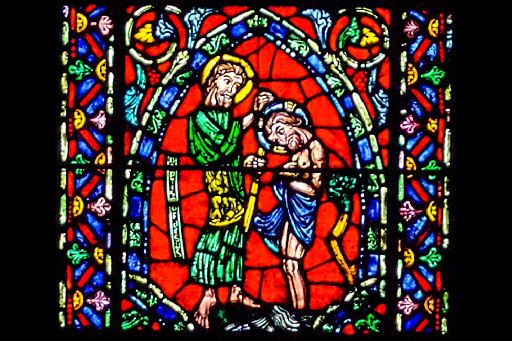 Baptism of Jesus in stained-glass window.