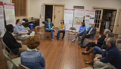 Community members share stories, prayers, reflections prompted by the Uneven Ground exhibition.