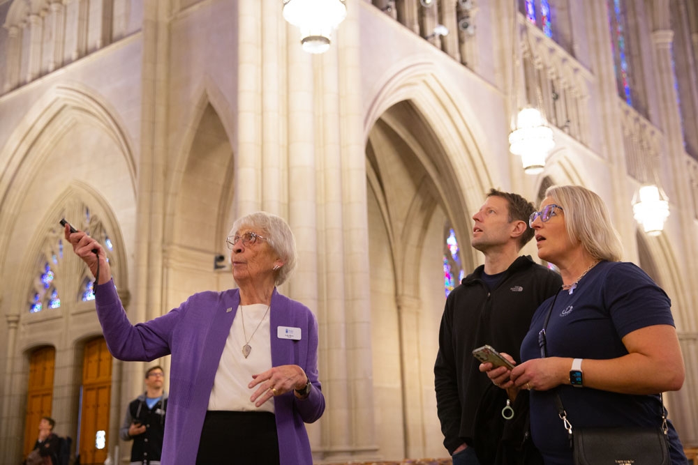Lois Oliver (left) gives a tour of the Chapel.