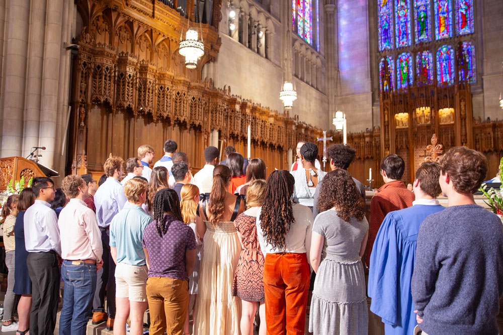 Chapel Scholar students receive a blessing during a Sunday morning worship service.