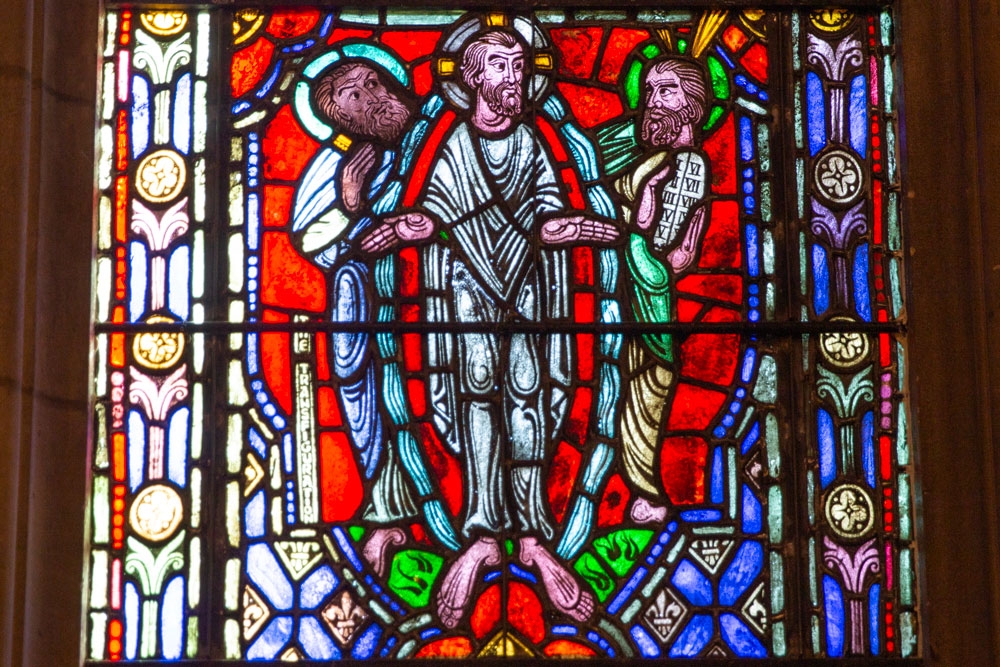 The Transfiguration scene in a Duke Chapel stained-glass window.