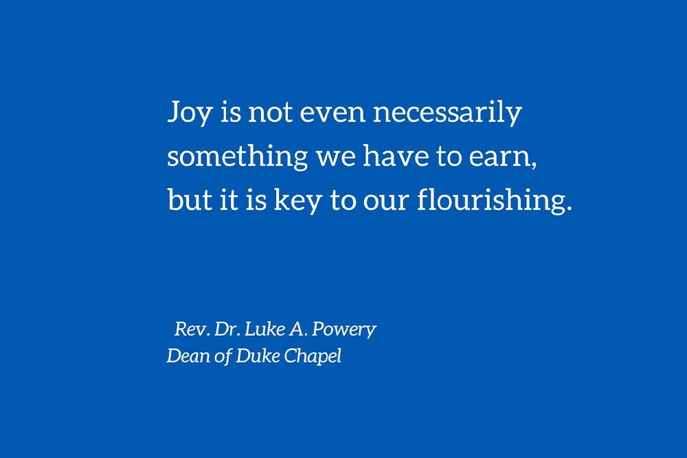 White text on blue background that reads: Joy is not even necessarily something we have to earn, but it is key to our flourishing