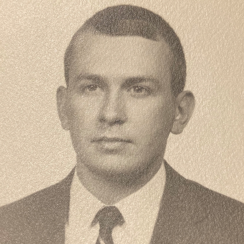 Black and white photograph of Thomas Redmon in 1969 dressed in suit and tie