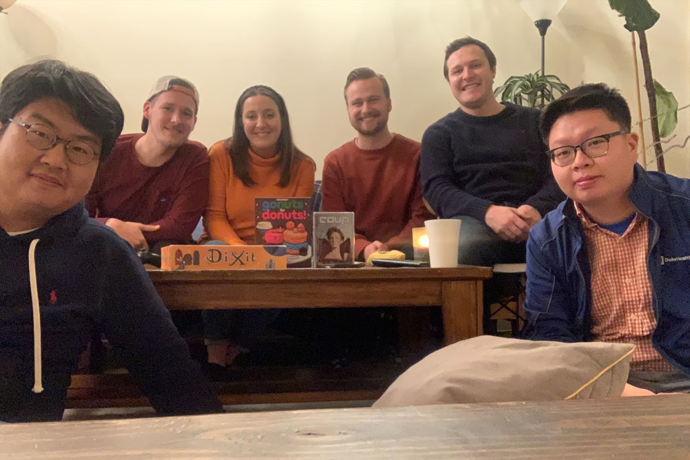 People in a Bible study pose around a coffee table
