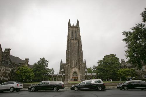 Funeral motorcade parked in front of Duke Chapel.